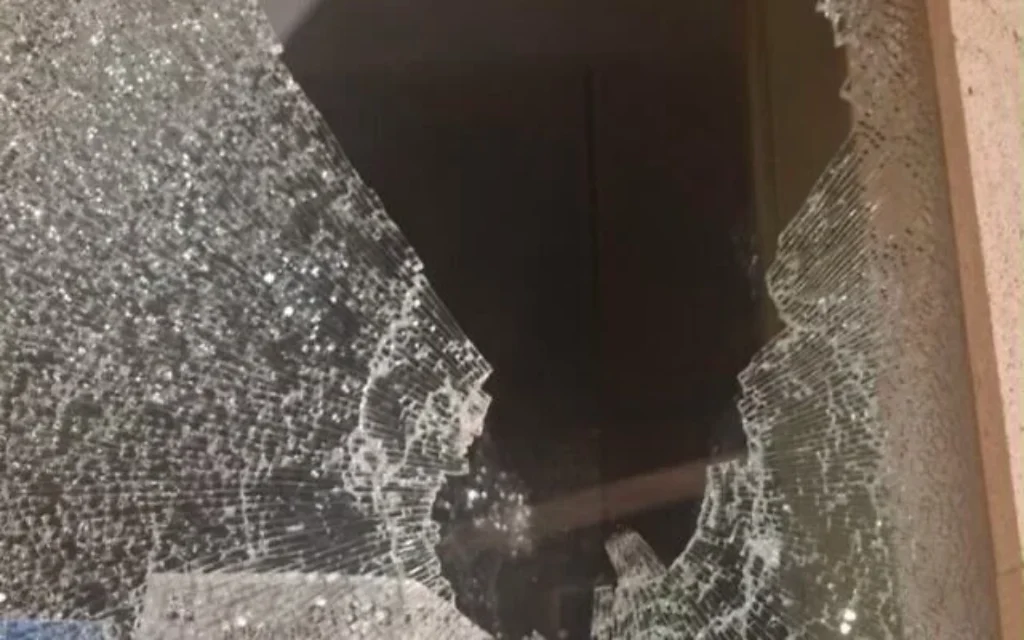 A shattered window following the incident. Photo Credit: X, via Times of Israel