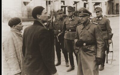 Jurgen Stroop interrogates two captured Jews