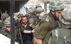 Marwan Barghouti is detained by Israeli soldiers in Ramallah during Operation Defensive Shield in April 2002. Photo Credit: Wikipedia Marwan Barghouti is detained by Israeli soldiers in Ramallah during Operation Defensive Shield in April 2002. Photo Credit: Wikipedia