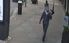 A man carrying what police believe was a toy gun in Edgware on Wednesday. (Photo via London Now) A man carrying what police believe was a toy gun in Edgware on Wednesday. (Photo via London Now)