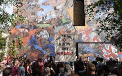 People march past the 'Cable Street' mural in Whitechapel, east London, to mark the 90th anniversary of the Battle of Cable Street, a huge demonstration in 1936 to block Oswald Mosley and his Blackshirts from marching through the East End of London. Organisers said the so-called Battle of Cable Street was a massive moment in history, when ordinary men, women, and children, stood shoulder to shoulder saying that organised fascists would not march through their community. Picture date: Sunday October 4, 2026.Photo credit: Aaron Chown/PA Wire People march past the 'Cable Street' mural in Whitechapel, east London, to mark the 90th anniversary of the Battle of Cable Street, a huge demonstration in 1936 to block Oswald Mosley and his Blackshirts from marching through the East End of London. Organisers said the so-called Battle of Cable Street was a massive moment in history, when ordinary men, women, and children, stood shoulder to shoulder saying that organised fascists would not march through their community. Picture date: Sunday October 4, 2026.Photo credit: Aaron Chown/PA Wire