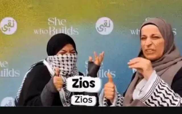 Sara El-Awaisi (right) demonstrates a game involving “Zios” and Al-Aqsa Mosque in footage posted online. (Credit: Social media)