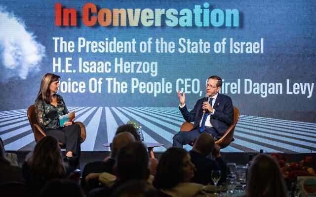 Israeli President Isaac Herzog speaks with Voice of the People CEO Ayelet Dayan Levy during an on-stage discussion. Photo Credit: Máté Fülöp
