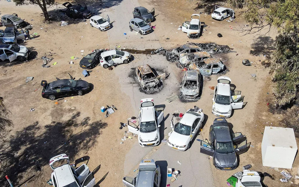 Burnt out cars at the entrance to Nova Festival, 7 October 2023