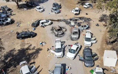 Burnt out cars at the entrance to Nova Festival, 7 October 2023