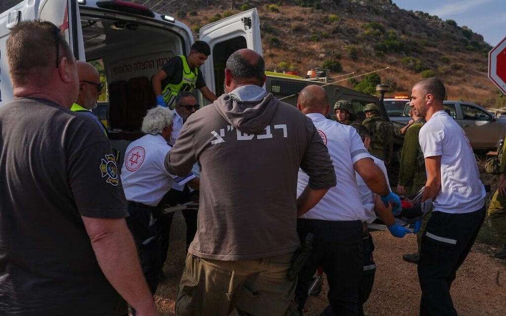 Israeli security and rescue forces evacuate injured people near the site where suspected unexploded ordnance detonated during a school trip near Kibbutz Yiftah in the Ramim Ridge area, close to the Israeli border with Lebanon, October 12, 2026. Photo by Ayal Margolin/Flash90 via JTA