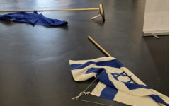Israeli and European Union flags lie on the floor at the European Parliament following the incident involving MEP Rima Hassan. Photo Credit: Yaron Bob