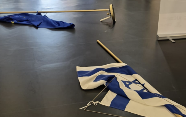 Israeli and European Union flags lie on the floor at the European Parliament following the incident involving MEP Rima Hassan. Photo Credit: Yaron Bob