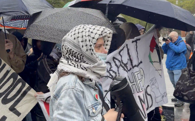 A protester with their face partially covered at the pro-Palestinian student march in central London on 7 October. Credit: Dov Forman