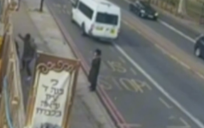 An image from the video of the attack - the alleged assailant can be seen on the left, with an arm raised