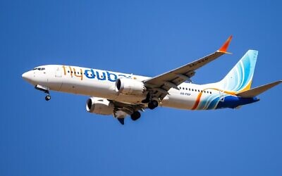 A flydubai passenger plane flies over Ben Gurion International Airport, central Israel, September 9, 2026. (Yossi Aloni/Flash90)