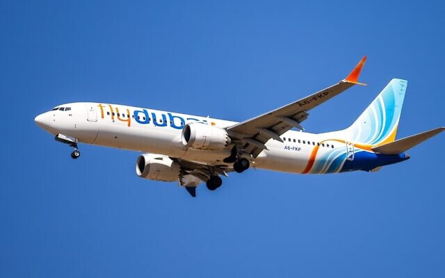 A flydubai passenger plane flies over Ben Gurion International Airport, central Israel, September 9, 2026. (Yossi Aloni/Flash90)
